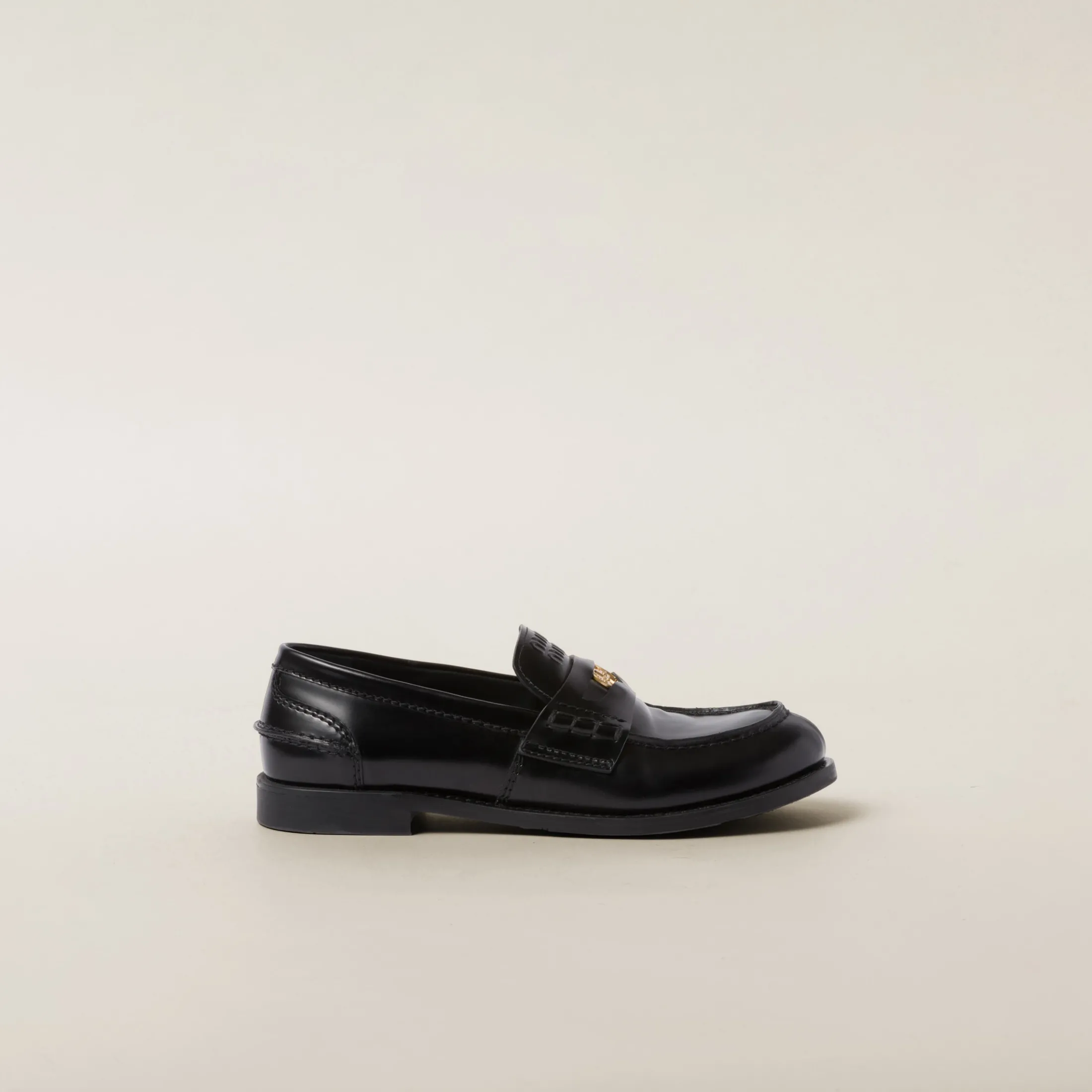 Black Brushed Leather Penny Loafers | Miu Miu