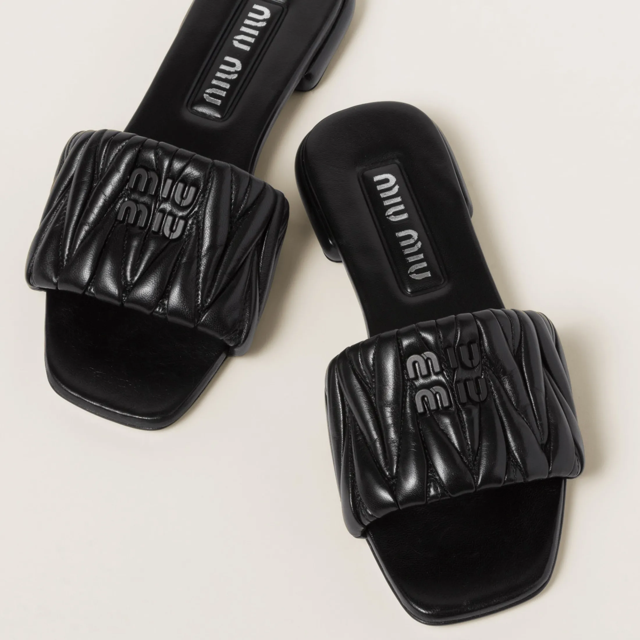 Black Matelassé Nappa Leather Slides | Miu Miu