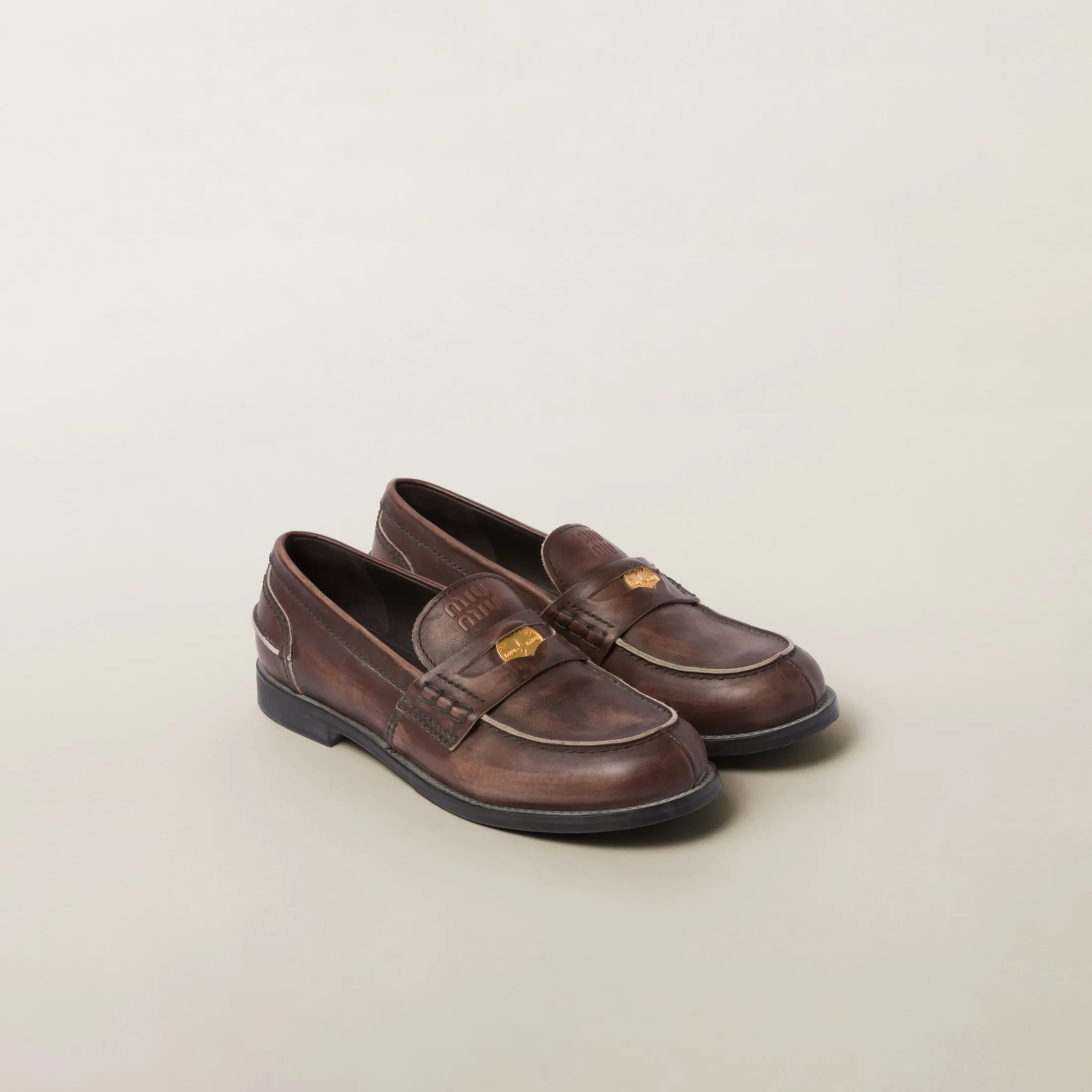 Ebony Vintage-effect Leather Penny Loafers | Miu Miu
