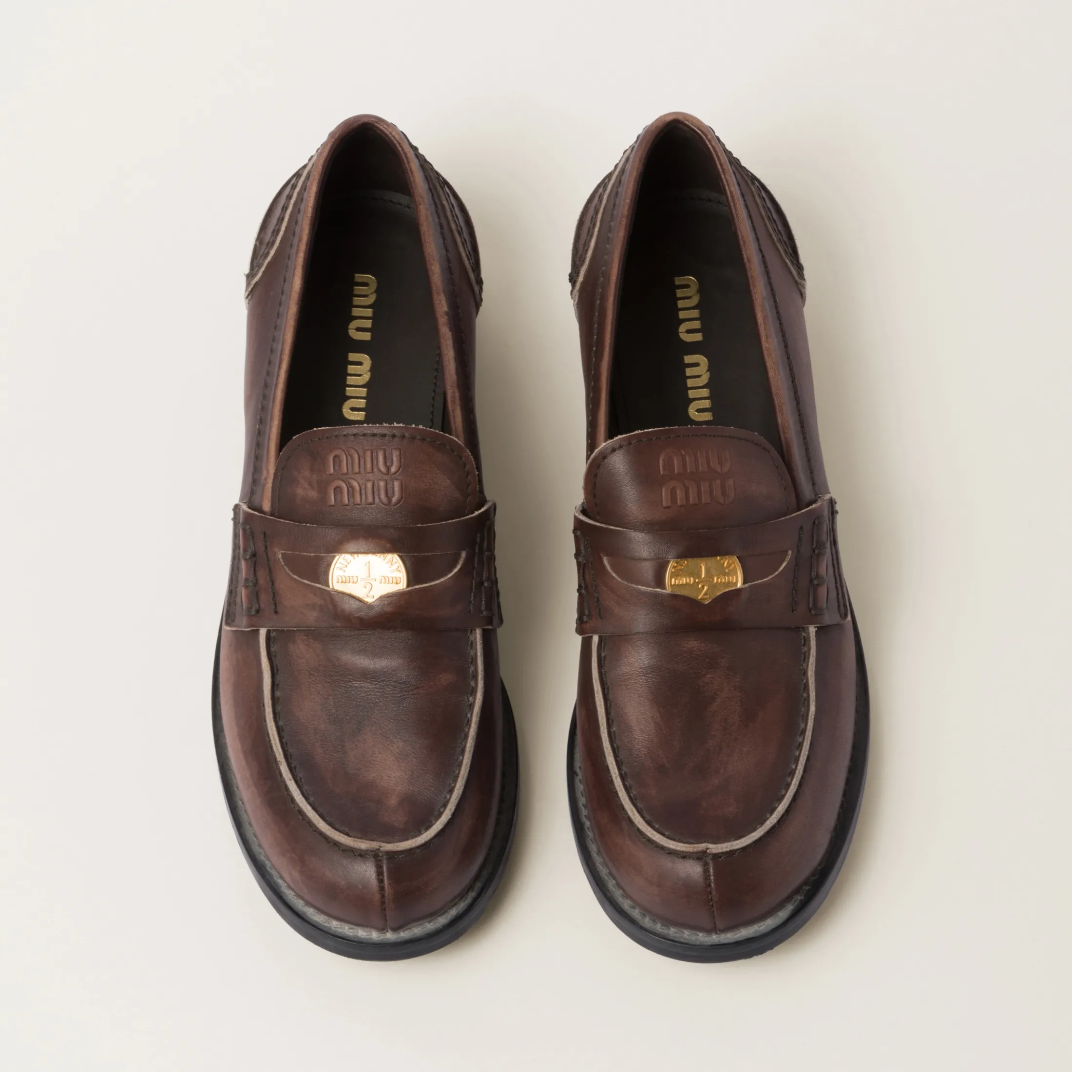 Ebony Vintage-effect Leather Penny Loafers | Miu Miu